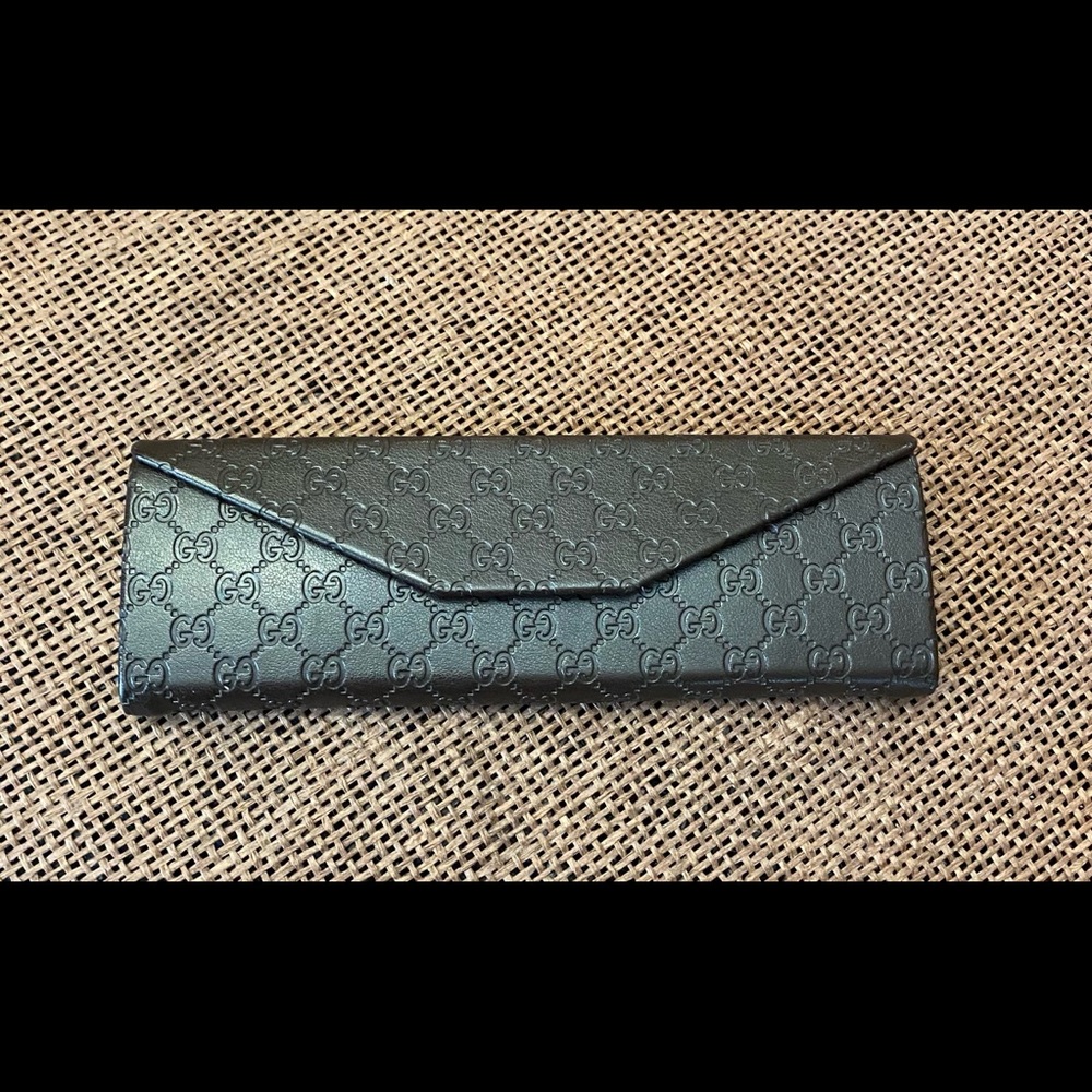 Gucci Brown Glass Case .